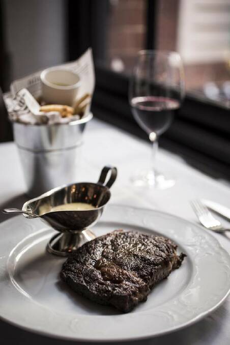 Settle in for classic French fare - such as steak, Bearnaise and entrecote frites - at Bistrot Gavroche. Photo: Dominic Lorrimer