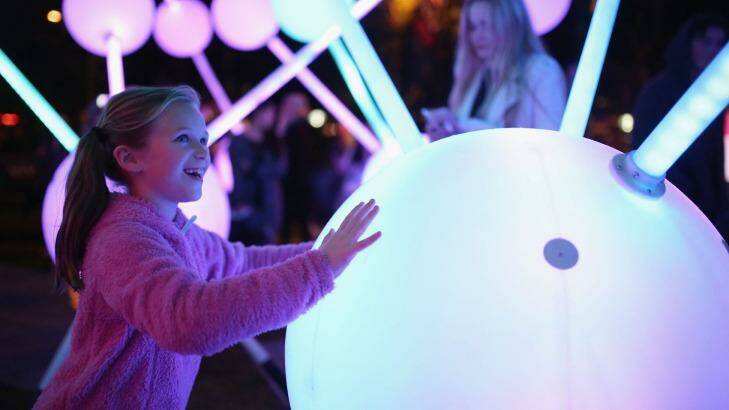 Seven-year-old Charlotte Bell is enthralled with the light installations at the opening night of Vivid Festival. Photo: Cole Bennetts