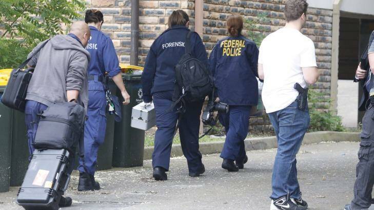Police search a house in Wentworthville.  Photo: Peter Rae