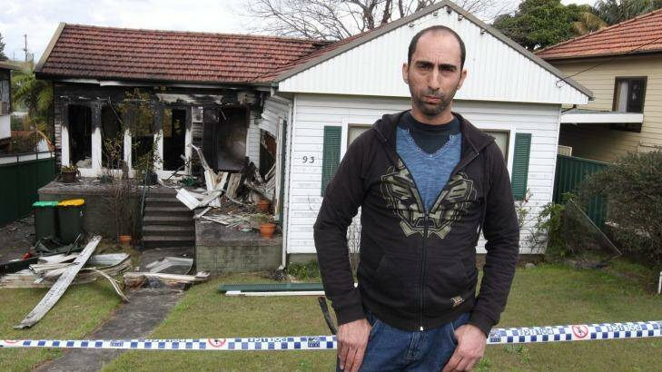 Gutted: Alex Haddad stands outside his investment property in Sydney's Ryde that was destroyed by fire. Photo: Peter Rae