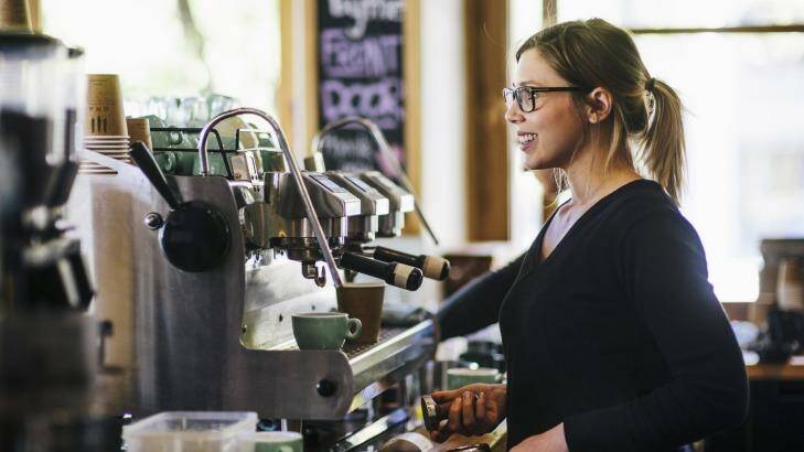 Head barista at The Cupping Room in Civic Caity Reynolds serving customers. Photo: Rohan Thomson