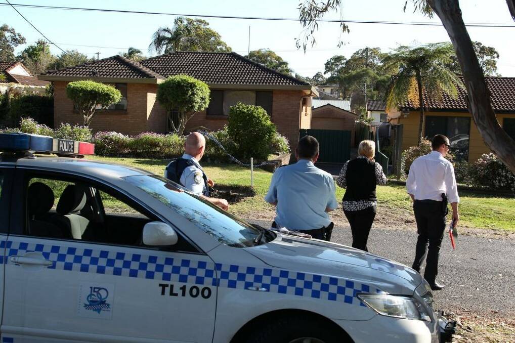 Murder charge: police at the scene. Photo: Phil Hearne