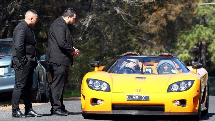 A guest arrives for the wedding at Longuevue Mansion in a flash car. Photo: Andrew Murray