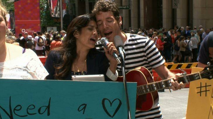 Singer songwriter duo Edo & Jo perform I'll Ride With You in Martin Place. Photo: Fairfax Media
