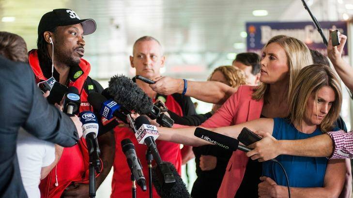 Chris Gayle faces the media at Melbourne airport. Photo: Josh Robenstone