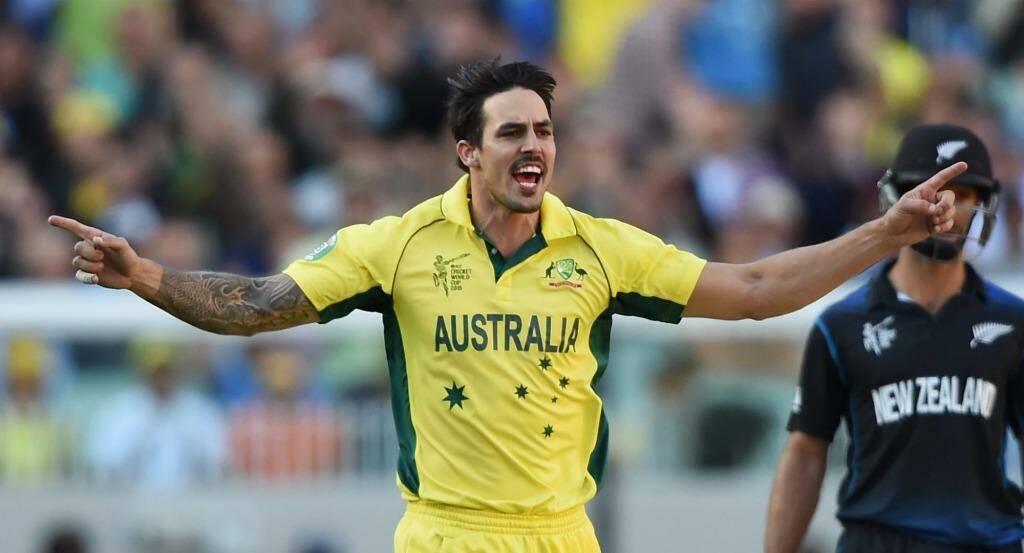 Australia's Mitchell Johnson celebrates the dismissal of New Zealand's Daniel Vettori during the World Cup final at the MCG on Sunday.  Photo: Andy Brownbill
