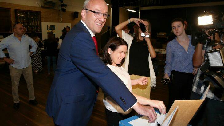 NSW Opposition Leader Luke Foley and wife Edel cast their vote at the Concord West Primary School voting booth, during the NSW State Election campaign on Saturday 28 March 2015. Photo: Alex Ellinghausen