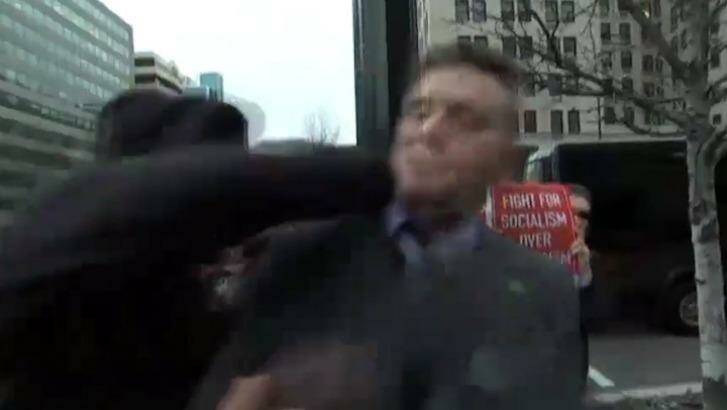 A man attacks Richard Spencer during the ABC's live interview. Photo: ABC