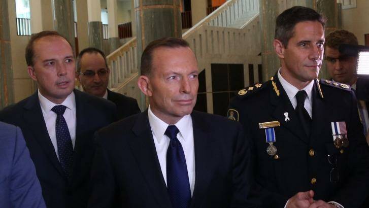 Immigration Minister Peter Dutton, Prime Minister Tony Abbott and Australian Border Force commissioner Roman Quaedvlieg. Photo: Andrew Meares