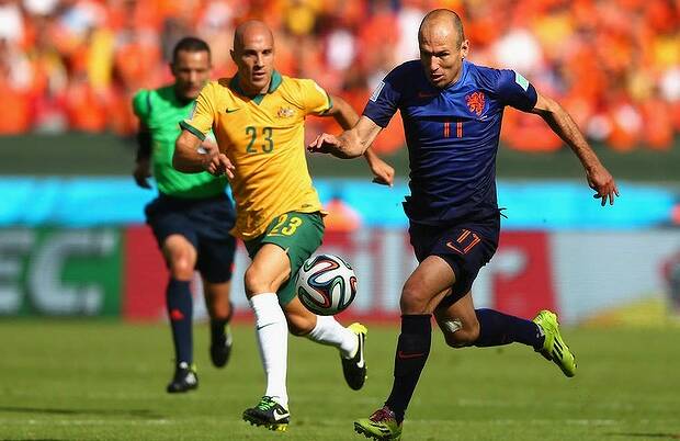 Arjen Robben of the Netherlands controls the ball on his way to scoring his team's first goal during the Group B match between Australia and Netherlands. Photo: Getty Images