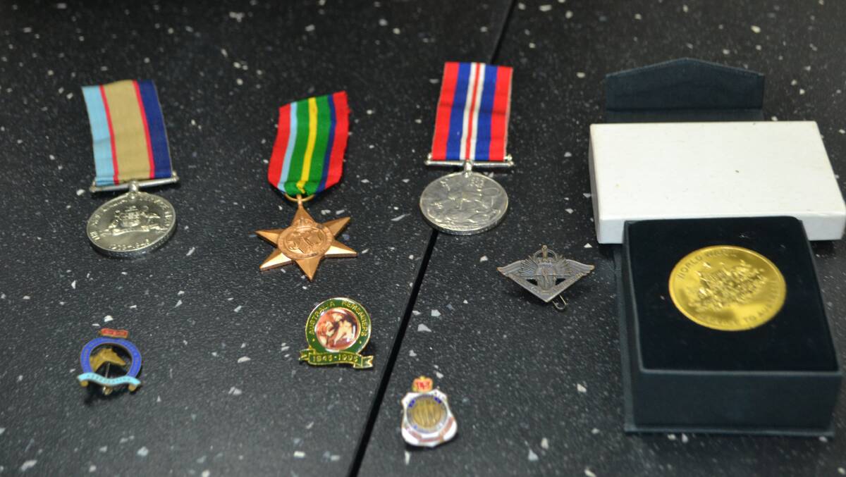 VALUABLE: The medals and badges left at the Batemans Bay Post Office.