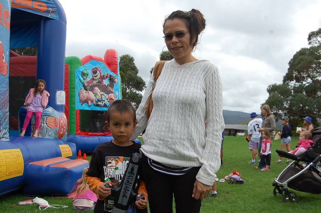 Wundarra Hayes was thrilled with his new sword, and is pictured here with his mum Rebecca at the Eden Public School fete on Wednesday.