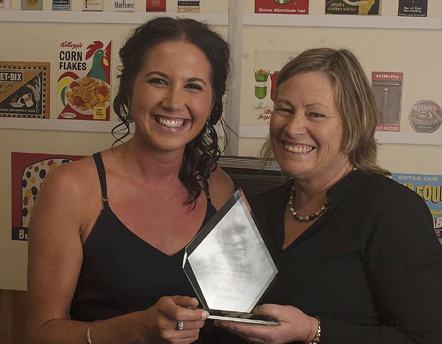 Manager Simone Griffiths and owner Georgie Staley accept the 'best retail business' runner-up trophy on behalf of Georgie's Fine Jewellery.