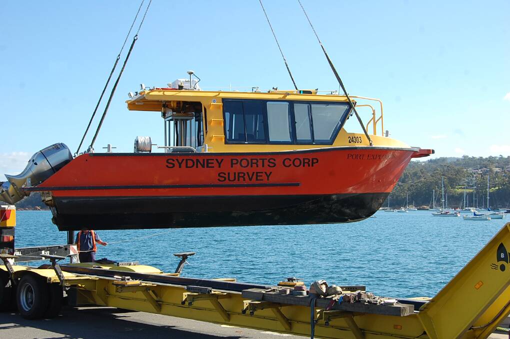 The Port Explorer is removed from Sung Cove by crane on Monday, after completing its annual hydrographic survey of the Port of Eden.