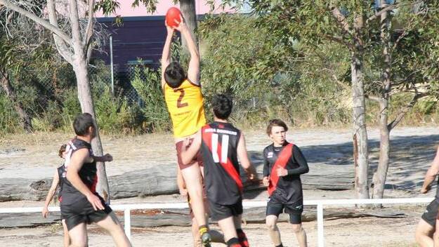 Pambula Panthers forward Tom Hammond takes a strong mark against the Bega Bombers earlier this month.