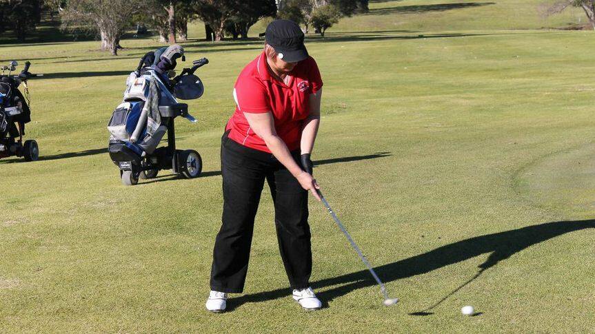 Eden golfer Sandy Huff hits a putt from just off the 18th green at the Bega Open Country Club Ladies Open in July.