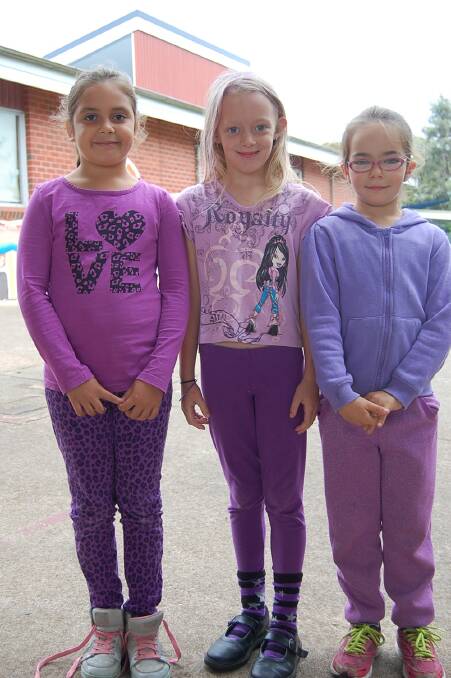 Eden Public School celebrated World Purple Day, with (from left) Shanoa Bamblett, Charlee Hughs and Lilly Romobouts-Wattam wearing purple to raise awareness for epilepsy.