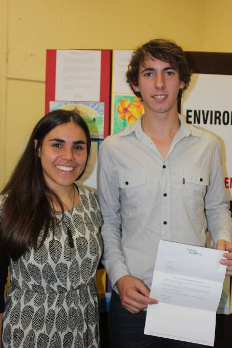 Eden Marine High School student Harrison Warne receives the inaugural Bournda EEC Future Leaders Environment Day Award from Amelia Telford, the indigenous coordinator for the Australian Youth Climate Coalition.