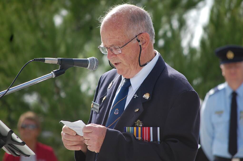 Eden RSL sub-branch president Barrie Beck addresses those gathered at the ANZAC Day 11am service at the Eden cenotaph.