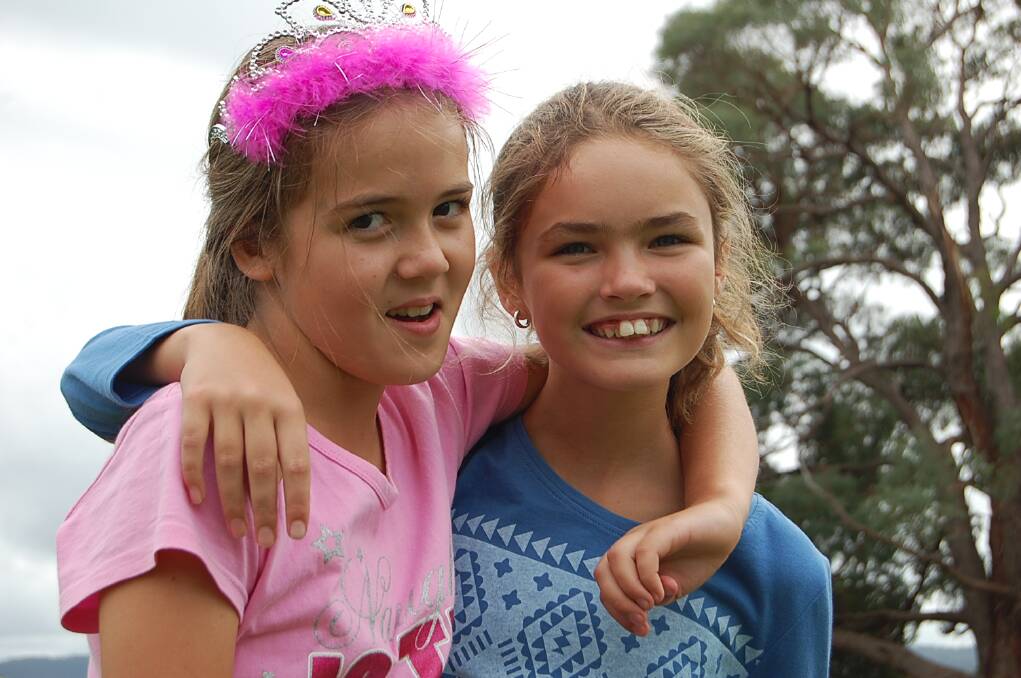 Claire Tanner (left) and Chloe Switzer enjoying the fun of the Eden Public School fete on Wednesday.