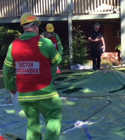Forest fire fighters from Eden were among a group who took part in some unorthodox fire training at a workshop in Batemans Bay, using toy trucks and model plans to map out fire response strategies.