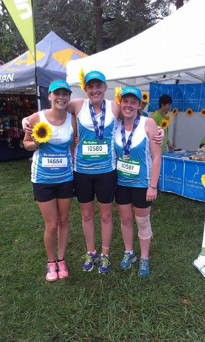 Sisters Emma (left) and Sam Clark, with friend Le-Tisha Kable at the Canberra Running Festival on Saturday.