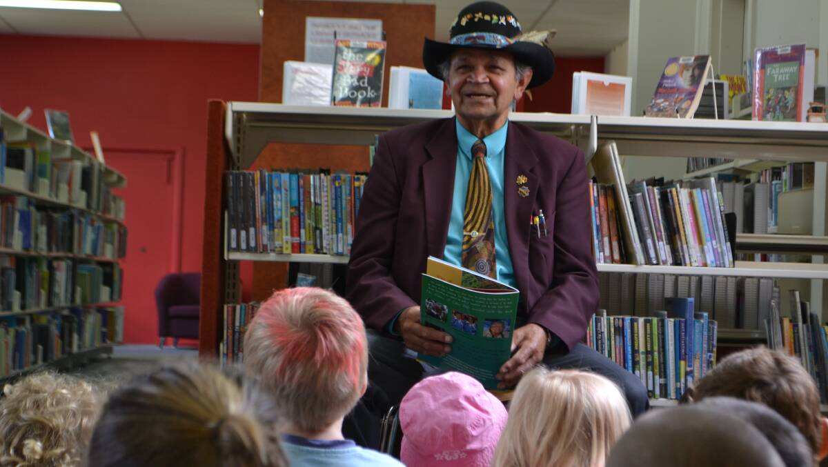 Pastor Ossie Cruse reads his book, ‘Booris of Eden’ to local school children.
