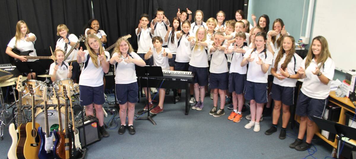 Year 7 music students sing ‘Paint You a Song’ at Eden Marine High School on Thursday. The song, which was performed by over 500,000 students nationwide, was written by a group of five that included Eden’s Emily Claxton.