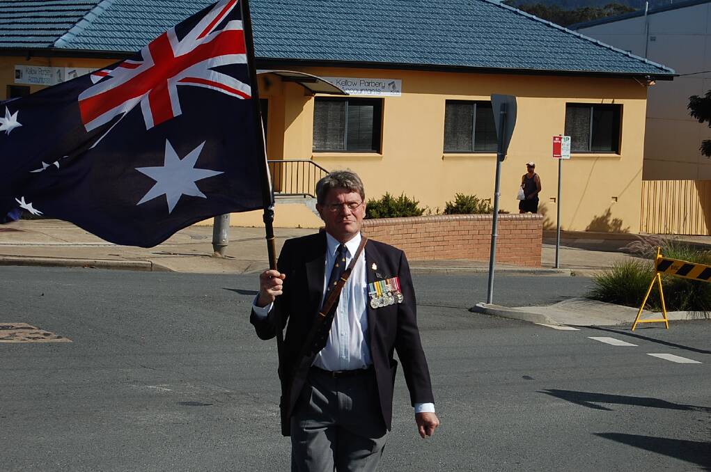 Richard Lamacraft leads the 2014 ANZAC Day march through Eden.