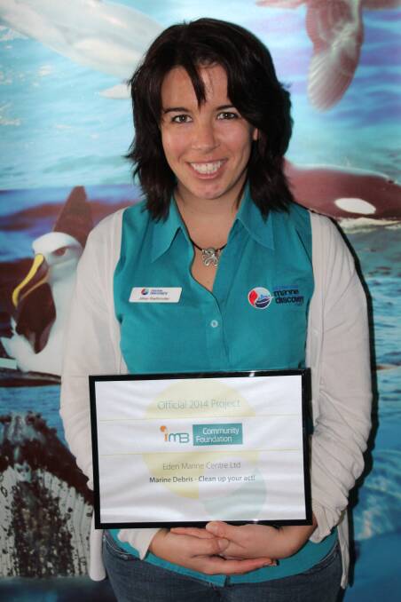 Sapphire Coast Marine Discovery Centre marine education officer, Jillian Riethmuller, with the grant certificate from the IMB Community Foundation.