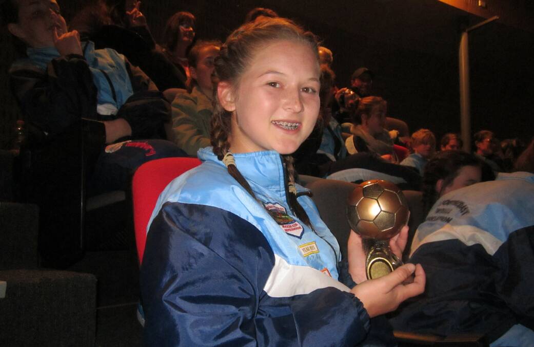 Bega soccer star Tayla Wilson celebrates being named player of the tournament at the Kanga Cup, where her Far South Coast Flames under 14s side made the semi-finals.