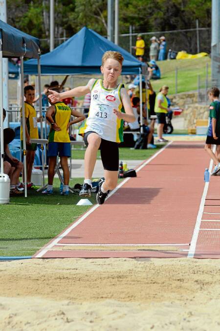 • Eden’s Riley Donaldson lunges forward in the 10 years long jump during the ACT carnival recently. 