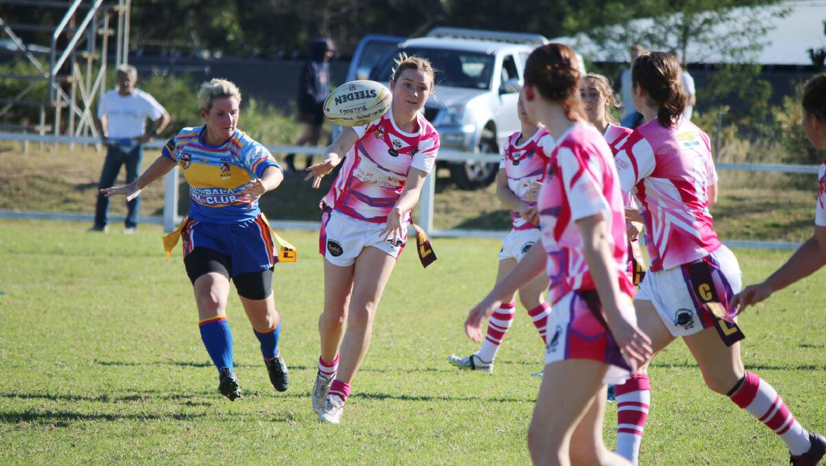 • Pink Panther Sam Moon offloads to a team-mate during a solid loss to Bombala last week. The Candelo-Bemboka club will host a women’s eight-a-side tournament in June.  