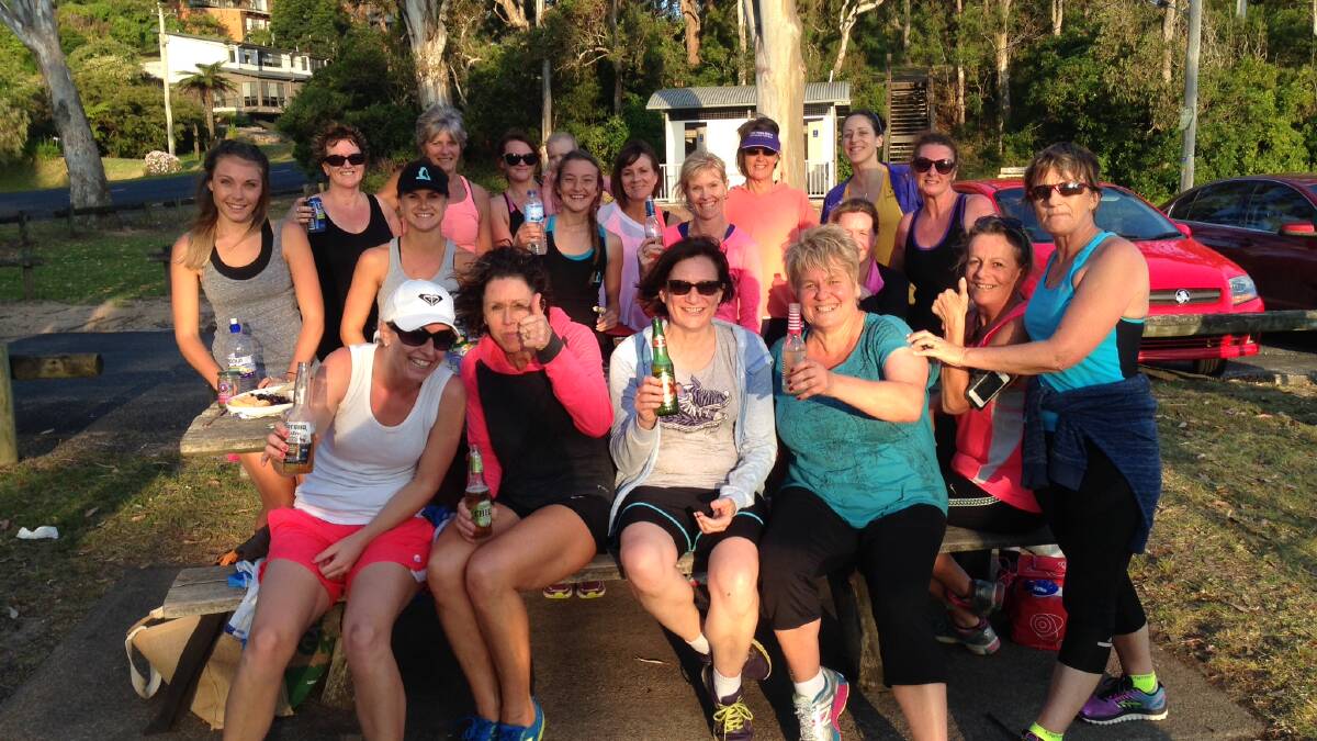 • Members of the Girls Run This Town running group enjoy a drink after their Go Hard run on Friday night. 