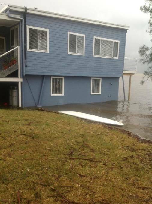 Brian Challis’s house on Reid Street at Wrights Beach has 20cm of water across its bottom level. 