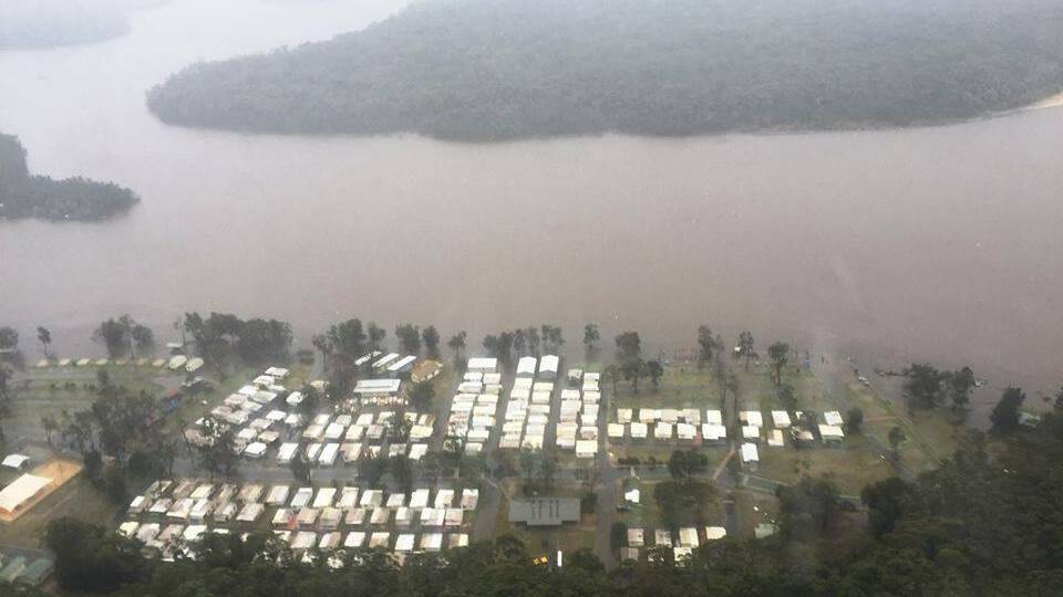 FROM THE AIR: The South Coast Lifesaver 23 helicopter has captured some great images of the flooding at Lake Conjola. 