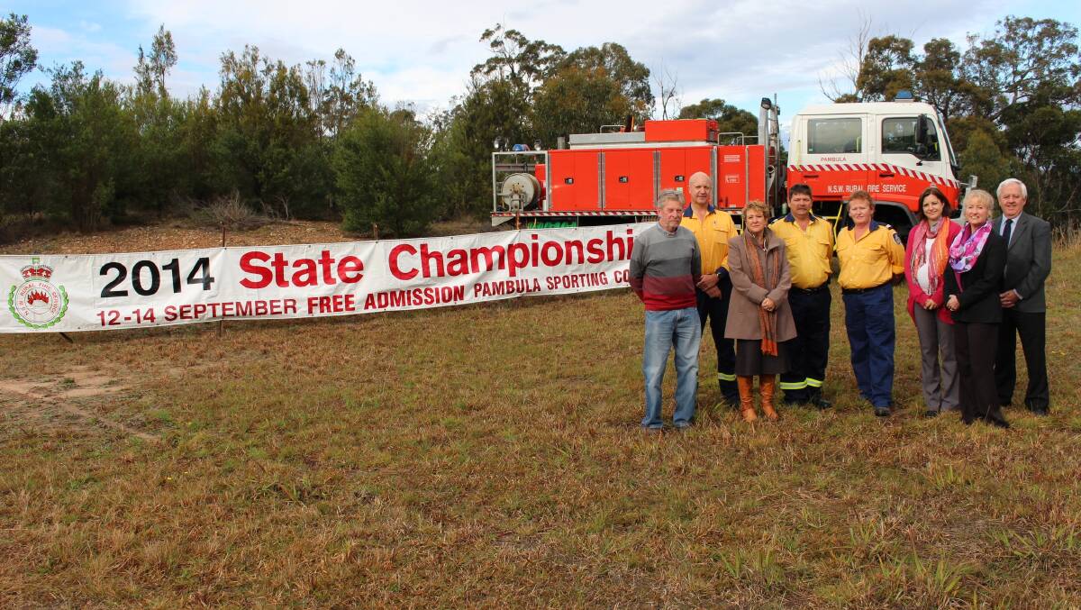 It’s coming … The promotional banner for the RFS State Championships to be held in Pambula mid September stands loud and proud at the intersection of Merimbula Drive and the Princes Highway.  And there to welcome its installation on Wednesday were Merimbula Chamber of Commerce executive member Serge Nachtergaele, left, Garry Cooper, Fire Mitigation Officer RFS Far South Coast Team, Cr Sharon Tapscott, Peter and Robyn Reynolds of the Pambula RFS, Cr Kristy McBain, Cr Ann Mawhinney and Mayor Bill Taylor. After three weeks the banner will be relocated to the Tathra area and then to Pambula. 