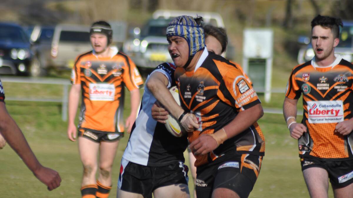 HIT-UP: Allan Barenaba takes a run for the Bay Tigers against Cooma in the elimination final on Saturday.