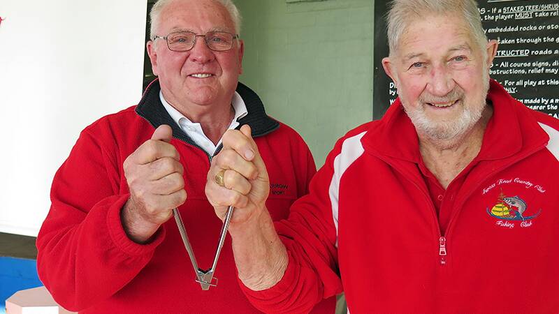 Outgoing Patron, Don Burns hands over the barbecue tongs to his replacement, David Greenhalgh.