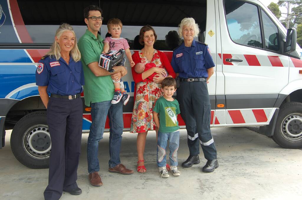 Audrey Rose Wood-Ingram is a little baby in a big hurry. Her mum Miriam Riverlea, of Mallacoota, was reunited on Tuesday with community ambulance officers Catherine Pirrie and Rosemary Hine who helped deliver Audrey in the back of an ambulance two weeks ago.  Photo Liz Tickner  