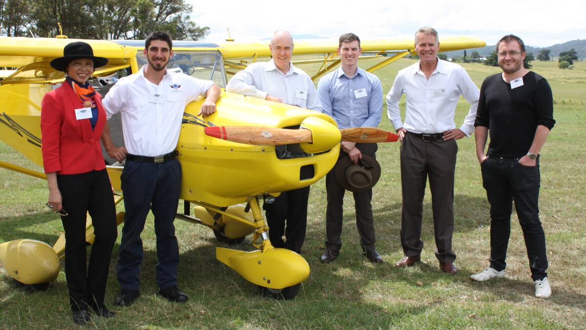 Discussing plans for a Chinese flight school at Frogs Hollow are Member for Oxley and former Deputy Premier Andrew Stoner (second from right) and company directors of Sports Aviation Australia (from left) Caroline Hong, Mitch Boyle, Jason Parker, Jason Ryan and Brad Stebbing. 