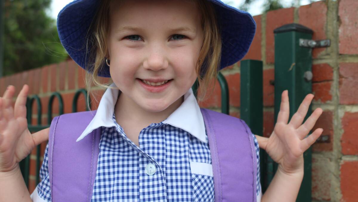 Little Amelia Wintle, with her big backpack and new uniform, is ready and excited to start at Eden Public School on Monday. Photo: Kate Liston