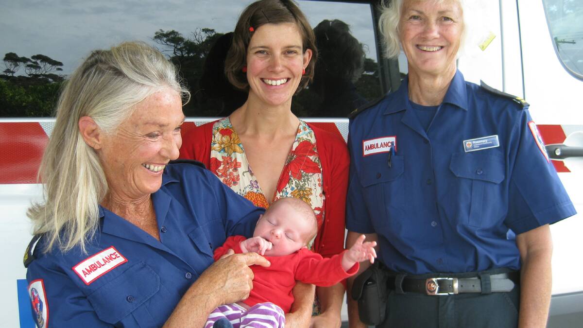 SPECIAL DELIVERY: Audrey Rose Wood-Ingram is a little baby in a big hurry. Her mum Miriam Riverlea, of Mallacoota, was reunited on Tuesday with community ambulance officers Catherine Pirrie and Rosemary Hine who helped deliver Audrey in the back of an ambulance two weeks ago.  Photo Liz Tickner  