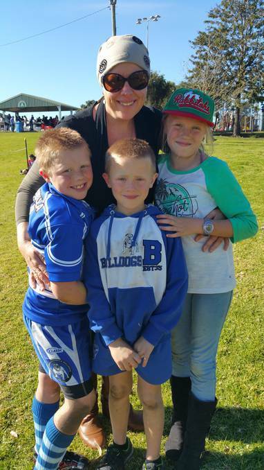 Pambula mum, Tracey Beasley, who is battling stage 4 melanoma, with her three children, Banjo, Toby and Molly. 