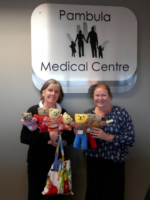 Immunisation nurse Sian Morton and receptionist Leesa Stewart take delivery of the colourful knitted Red Cross teddy bears and toys donated by the Wolumla Red Cross members. These gifts will be given to young patients who attend the Pambula Medical Centre. 
