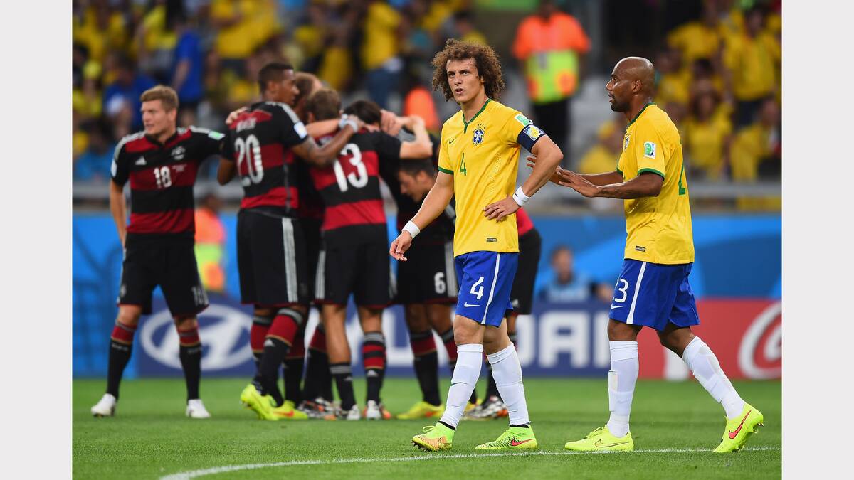 David Luiz and Maicon of Brazil react after allowing a goal during the 2014 FIFA World Cup Brazil Semi Final match between Brazil and Germany at Estadio Mineirao on July 8, 2014 in Belo Horizonte, Brazil.  (Photo by Laurence Griffiths/Getty Images)	
