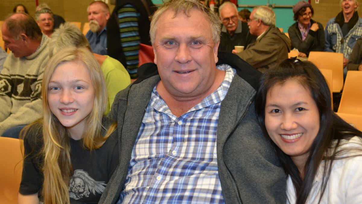Grace and Clive Bateman (left) and Koranit Khamrin snuggle in for Flickerfest.