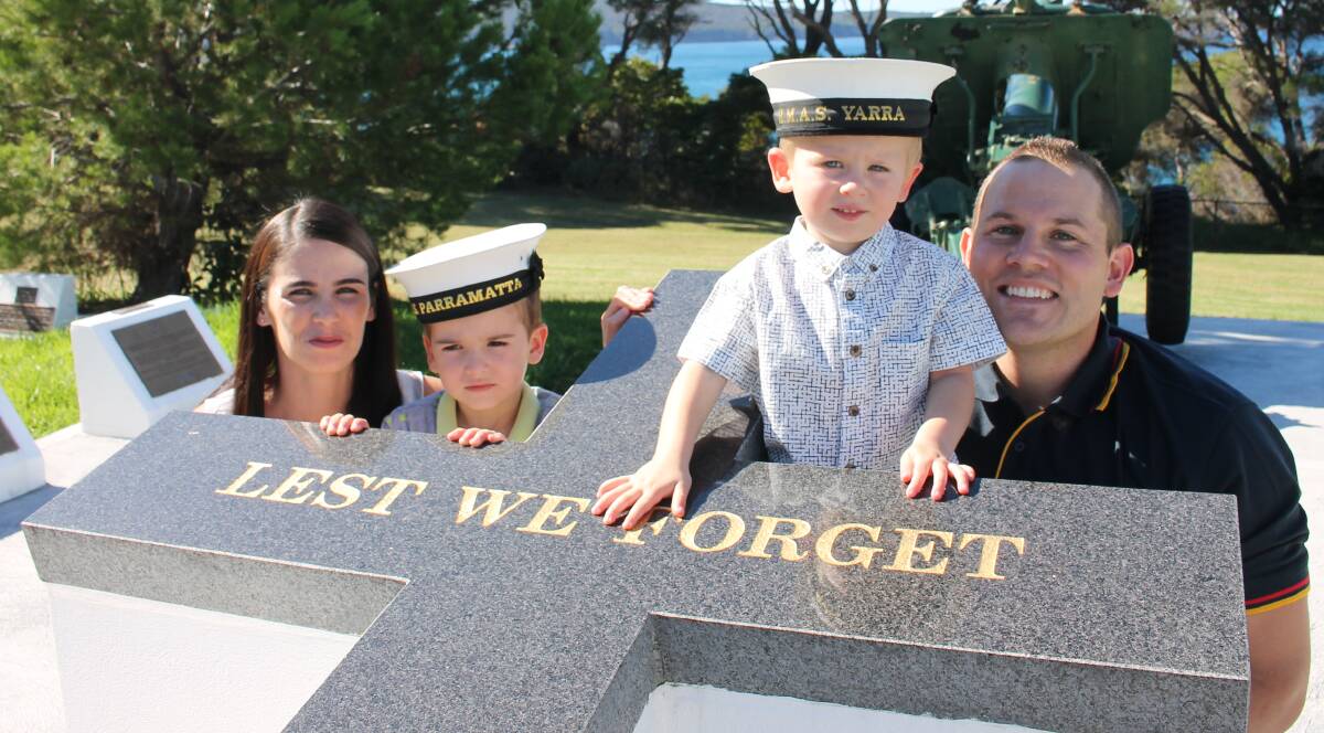 WE WILL REMEMBER THEM: Samantha Trewin, Ethan, 4, Lachlan, 2, and Aidan Death pay their respects at the Eden Cenotaph ahead of Anzac Day on Tuesday. Picture: Liz Tickner