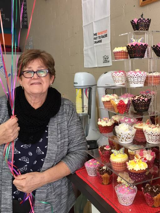 Animal Lover: Long time Cuppaz Cafe staff member Leonie Gavel with her impressive tower of cupcakes which she baked and sold to raise money for the RSPCA.