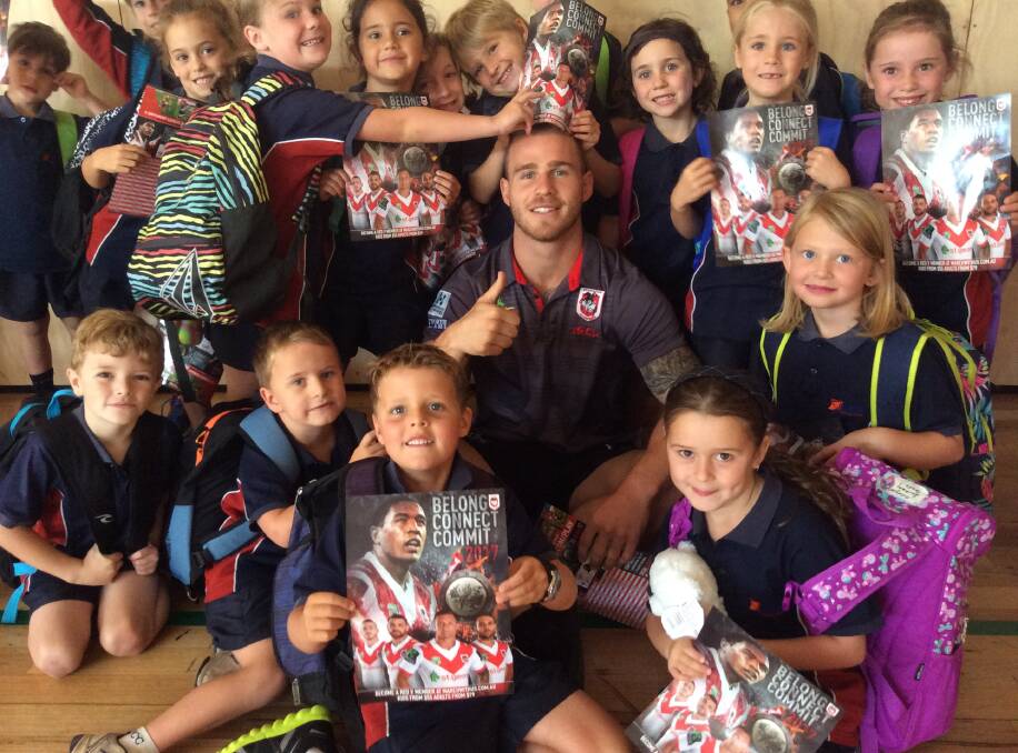 Lumen Christi Catholic College primary school pupils show their excitement at catching up with Dragons star Euan Aitken when he visited last week.